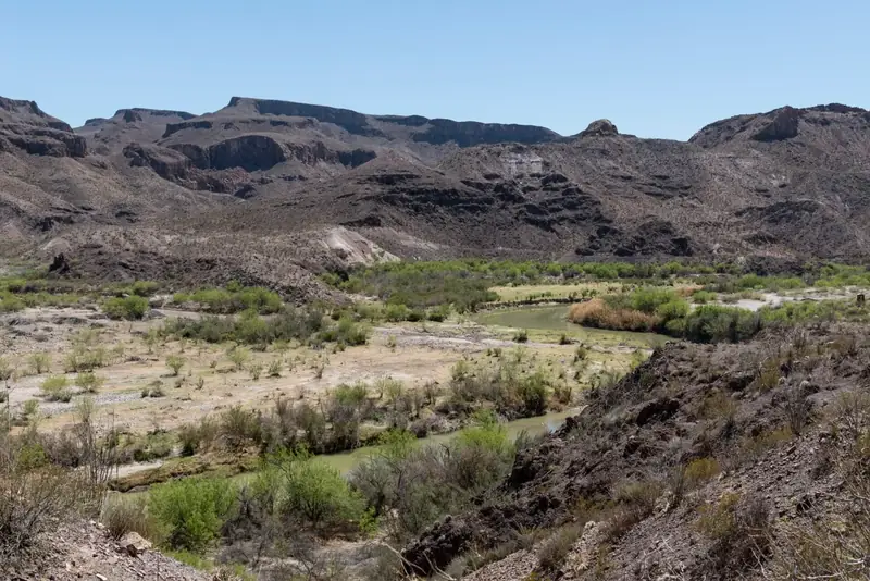 Rugged desert hills and a green valley in Big Bend Ranch State Park