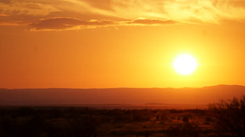 Sunset over the mountains beyond the flat, seen from the Viewing Area